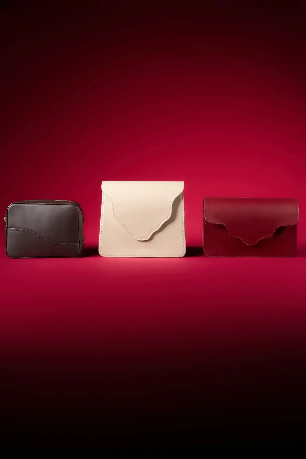Brown, cream, oxblood — three bags lined