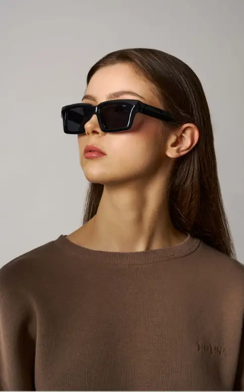 Brown sweater, sunglasses portrait