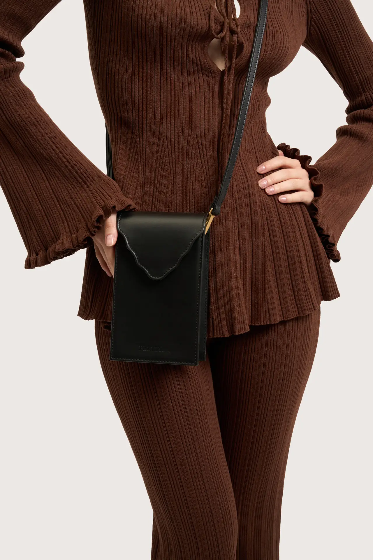 Black crossbody, brown ribbed knit